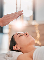 Image showing Spa, woman and healing energy for head, massage or body wellness to relax in luxury, resort or bed. Girl, reiki and physical therapy for health, peace or mindfulness with spiritual zen, hand or light