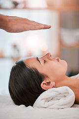 Image showing spa, woman and hands with light energy healing for luxury healthcare wellness or reiki peace. Relax, zen meditation therapy and spiritual peace with cosmetic expert person for palm focus chakra