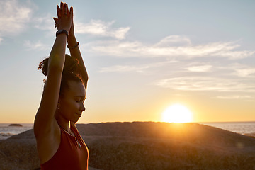 Image showing Yoga, sunset and nature with black woman at beach for meditation, zen exercise and prayer, hands for calm and peace. Fitness, woman outdoor for workout for healthy lifestyle, energy and mindfulness