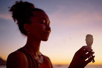 Image showing Black woman, meditation and mindfulness, burning sage for zen and cleanse, therapy and spiritual healing outdoor. Ritual at sunset, aromatherapy and wellness for positive energy and healthy mindset.