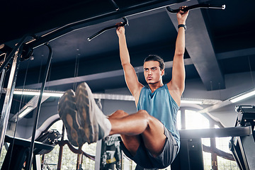 Image showing Fitness, exercise and weight training with a man at gym for a workout for focus and strong body and mindset for health and wellness. Bodybuilder or athlete using pull up bar for power and muscle