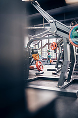 Image showing Gym interior, fitness and exercise with gym equipment and weightlifting for body training, health and wellness. Weights, muscle and strong for cardio and endurance with metal and steel for workout.