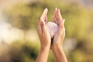 Image showing Woman, hands and rose quartz in nature for meditation or occult practice. Crystal, yoga stone or rock for relax, mindfulness and zen healing, spiritual growth and female spirit, chakra or awakening.