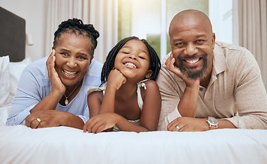 Image showing Love, grandparents and girl on bed, with smile and happy together to relax. Portrait, black family and with daughter in bedroom, bonding and being loving for happiness, quality time and on weekend.