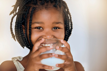 Image showing Milk, health and nutrition portrait of black kid for wellness, calcium and diet with smile. Young, girl and happy child holding dairy drink in glass for a healthy lifestyle with mockup.