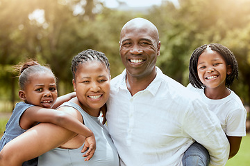 Image showing Black family, piggyback and children with a mother and father carrying their daughter siblings outdoor in a park. Portrait, happy and love with a man, woman and kids bonding together in nature