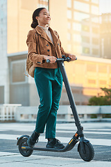 Image showing Electrical scooter, woman and city travel on eco friendly transportation, sustainability and clean carbon footprint in urban town. Hipster, student and black girl riding mobile electric scooter ebike