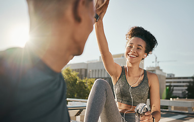 Image showing Fitness, success and couple high five after training in a city, happy and relax after morning cardio with mockup. Personal trainer, black woman and hands in support of well done, motivation and goal