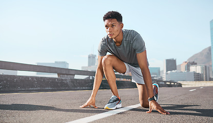 Image showing Black man, city runner and start running training on road, outdoor cardio exercise and sprinting practice marathon workout run. Sprint athlete exercising, town street and ready to start summer race