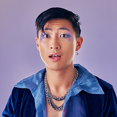 Image showing Punk, makeup and face in shock, wow and surprise with a gay man on a purple studio background for future or retro fashion. Cosmetics, cyberpunk and lgbtq aesthetic model for vaporwave portrait