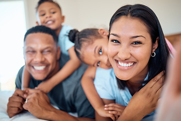 Image showing Family selfie, children and bonding in bedroom of house, home or hotel in trust, love or security pov. Portrait, smile or happy mother, father and kids in photography for social media profile picture