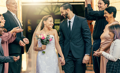 Image showing Marriage love, couple and wedding celebration applause from excited group of people, church crowd or clapping guest audience. Partnership commitment ceremony, man and woman walk with flower bouquet