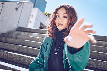 Image showing Fashion, trendy and portrait of a woman in the city with a stylish, edgy and street wear outfit. Youth, stylish and girl model from Mexico posing with her hand in an outdoor road in a urban town.