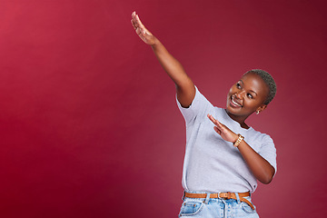 Image showing Dance, marketing and happy black woman in studio with a red background in celebration of a sale or discount. Success, winner and excited African girl dancing with pride with advertising mockup space