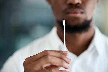 Image showing Doctor, hands and covid test swab for appointment, examination or results for healthcare at the hospital. Hand of medical professional holding nasal pcr sample for testing corona virus or diagnosis