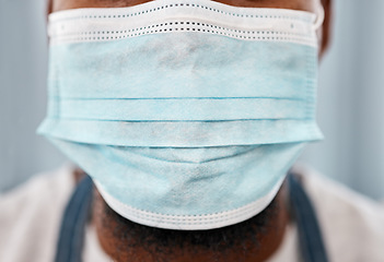 Image showing Covid, healthcare and closeup of face mask on black man for safety, wellness and global virus protection. Medical, breathing and caution with ppe and guy for compliance, insurance and pandemic risk