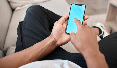 Image showing Man, hands or phone green screen mockup for advertising space, digital marketing media or internet esports ux. Blue screen, mock up or chroma key on mobile technology social media app in living room