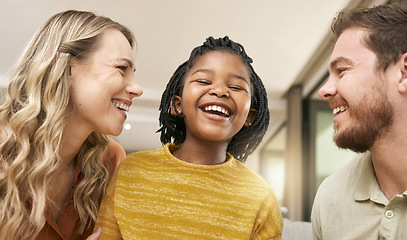 Image showing Family, adoption and parents with girl in home having fun, laughing and bonding together on weekend. Love, multicultural and happy mom and dad with african american daughter relax in living room