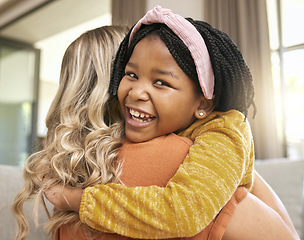 Image showing Hug, mother and adopted black girl in living room of house, foster home or orphanage in support, trust and security. Portrait, smile or foster mom with happy child, kid or youth in thank you embrace