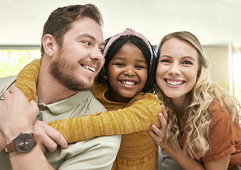 Image showing Family, adoption and parents hug child, love and happiness with child care portrait, relax at family home. Happy, bonding and interracial people with foster care and mother, father with kid.