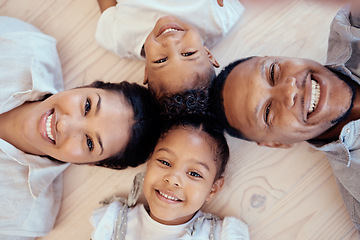 Image showing Happy, smile and portrait of family on floor with top view for bonding, support or relax in living room. Funny, playing and affection with face of parents and children on ground at home for happiness