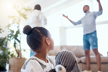 Image showing Argument, divorce and scared child in the living room with a teddy bear for comfort in a modern house. Family, break up and parents fighting with disagreement in front of girl kid in lounge at a home