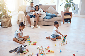 Image showing Mother, father or children in house living room or Brazilian family home with phone movie streaming, toy building blocks and abacus math set. Man, woman or kids in relax game and education technology