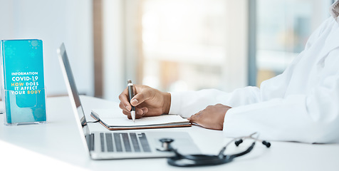 Image showing Covid, laptop and writing with a doctor working on research in an office in the hospital for cure or treatment. Computer, notebook and healthcare with a medicine professional working on medical care