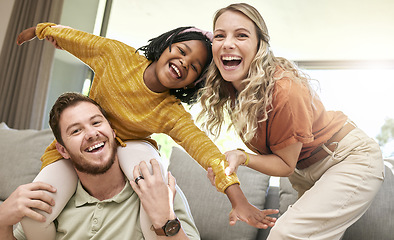 Image showing Adoption, love and portrait of family on sofa laughing, smiling and having fun together. Happiness, bonding and multicultural happy family at home with young daughter playing with foster parents