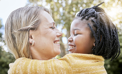 Image showing Hug, smile and mother love with girl in a nature park with love, foster care and diversity. Happy, relax and hugging mom and adopted kid bonding together in summer on mothers day or holiday outdoor