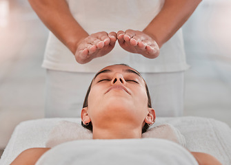 Image showing Relax, health and reiki with woman on spa table for healing energy, zen and alternative medicine. Peace, wellness and luxury with hands of massage therapist for holistic, chakra and spiritual detox