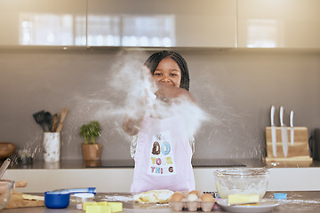 Image showing Education, learning and portrait of black girl cooking in kitchen and having fun. Development, baking and happy kid chef playing with flour, preparing egg and delicious food recipes alone in house.