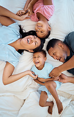 Image showing Happy, fun and family bedroom bed with mother, father and kids laughing in the morning at home. Funny time, love and parents care about children tickle and play together with happiness and bonding