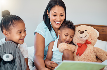 Image showing Relax, storytelling and book with mother and children for learning, fantasy or creative in family home. Happy, bonding and smile with mom reading to kids in bedroom to study, education and teddy bear