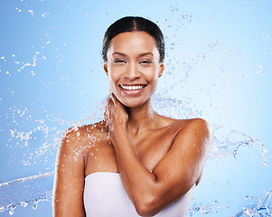 Image showing Shower, water and black woman in splash and clean portrait with grooming and hygiene against blue studio background. Wet, water droplets and fresh with skincare, body care and hydration mock up.