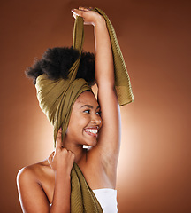 Image showing Black woman, afro hair and scarf for fashion, in studio and trendy clothes, african culture or heritage. Happy young black girl model, curly hairstyle and head wrap for beauty, confidence and glamour