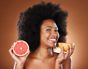 Image showing Beauty, skincare and grapefruit with portrait of black woman for vitamin c, nutrition and health. Wellness, diet and citrus product with girl model and fruit for cosmetics, collagen and natural detox