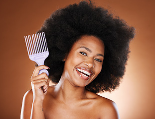 Image showing Beauty, hair and afro and black woman and comb for self care, natural and freedom. Happy, smile and untangling with portrait of African girl model and curly hair for luxury and confidence