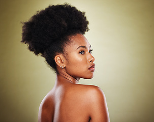Image showing Black woman, afro hair and body skincare glow on green studio background in healthcare wellness, dermatology or self love cosmetology. Beauty model, makeup cosmetics and natural hair style on mock up