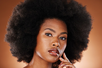 Image showing Black woman, face and skincare beauty or hair care aesthetic for cosmetics wellness. Afro, african girl and model portrait for self care makeup or skin glow dermatology in orange background studio