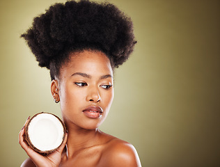Image showing Coconut, beauty and black woman in studio for natural hair care, skincare and healthy product marketing or advertising mockup. African model with coconut oil cream for skin care glow or hair growth
