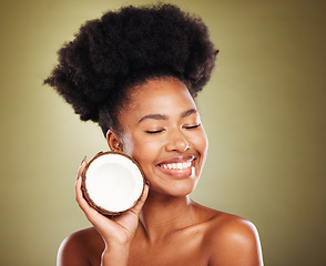 Image showing Beauty, skincare and smile with black woman and coconut for moistuize, rejuvenation or tropical. Antioxidants, natural and vitamins with luxury girl model for nutrition, diet or organic treatment