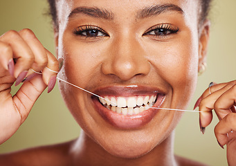 Image showing Black woman, teeth and smile for dental floss, skincare or cosmetic treatment against a studio background. Portrait of happy African American toothy female model flossing mouth for clean oral hygiene
