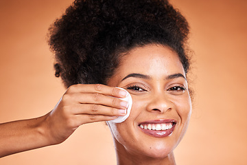 Image showing Black woman, beauty and swab for makeup removal in skincare against a studio background. Portrait of African American female model smile removing facial cosmetics in satisfaction for skin treatment