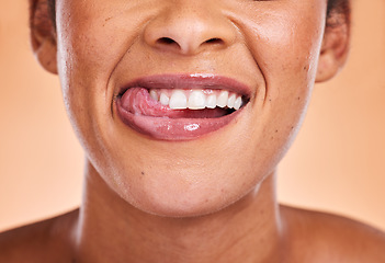 Image showing Woman, mouth and smile with teeth for dental care, cosmetics or surgery against a studio background. Female smiling in satisfaction for medical tooth, oral or gum care wellness and treatment