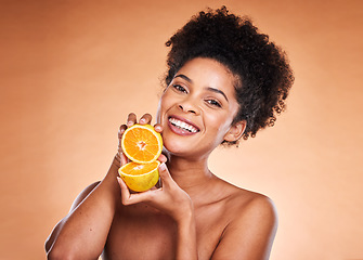 Image showing Skincare, beauty and portrait of black woman with lemon on orange background in studio. Wellness, cosmetics and girl with fruit advertising natural, organic and healthy skincare products for spa