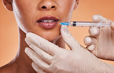 Image showing Woman, lips and hands for plastic surgery injection, botox or skincare treatment against a studio background. Hand of medical expert injecting female mouth in cosmetic surgery for fillers or implants