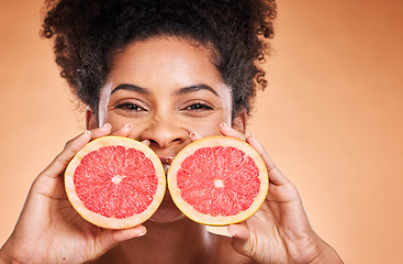 Image showing Grapefruit, black woman and vitamin c beauty, skincare and wellness, healthy body and aesthetics, natural cosmetics and face on studio background. Portrait of african model, citrus nutrition and diet