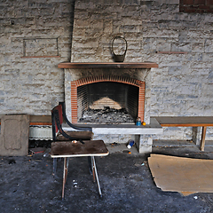 Image showing dirty fireplace in abandoned interior