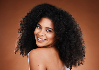 Image showing Curly hair, black woman and natural skincare, portrait and beauty for makeup, confidence or facial cosmetics, aesthetic and wellness on studio background. Happy african model face, afro and happiness